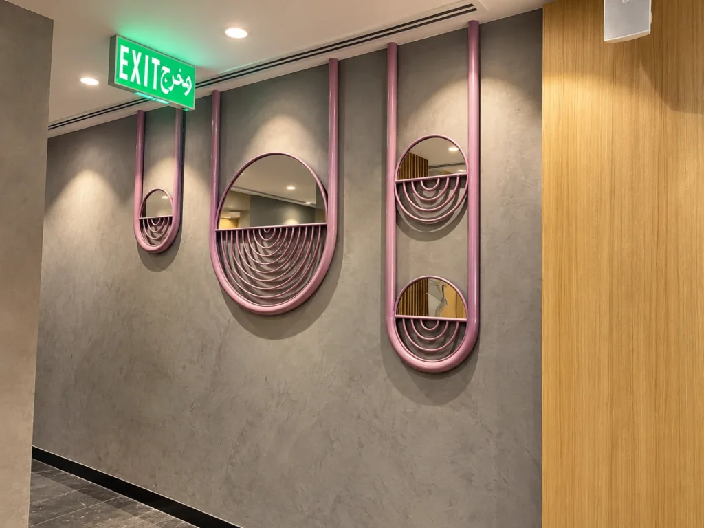Modern Foyer with Mauve Arc Mirrors_converted