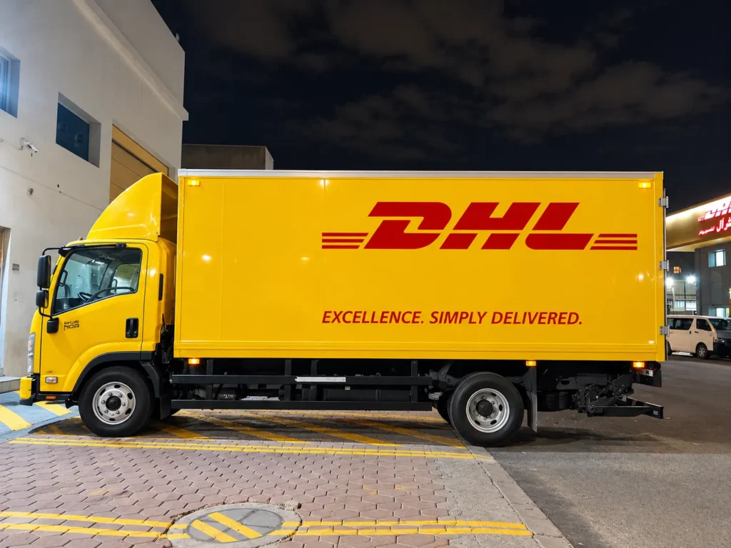 Nighttime DHL Delivery Truck at Warehouse_converted