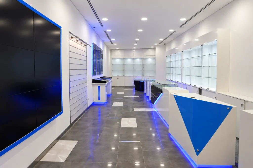 Sleek Blue-lit Electronics Showroom_converted